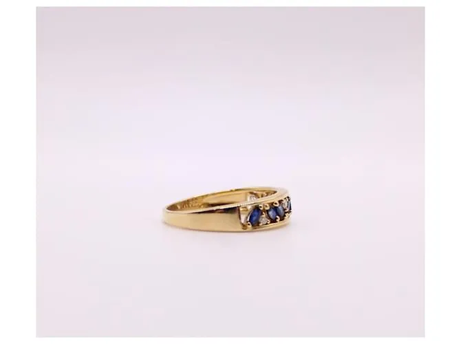 Autre Marque Anillo liga de oro amarillo con zafiros y diamantes 750%O Azul oscuro Gold hardware 